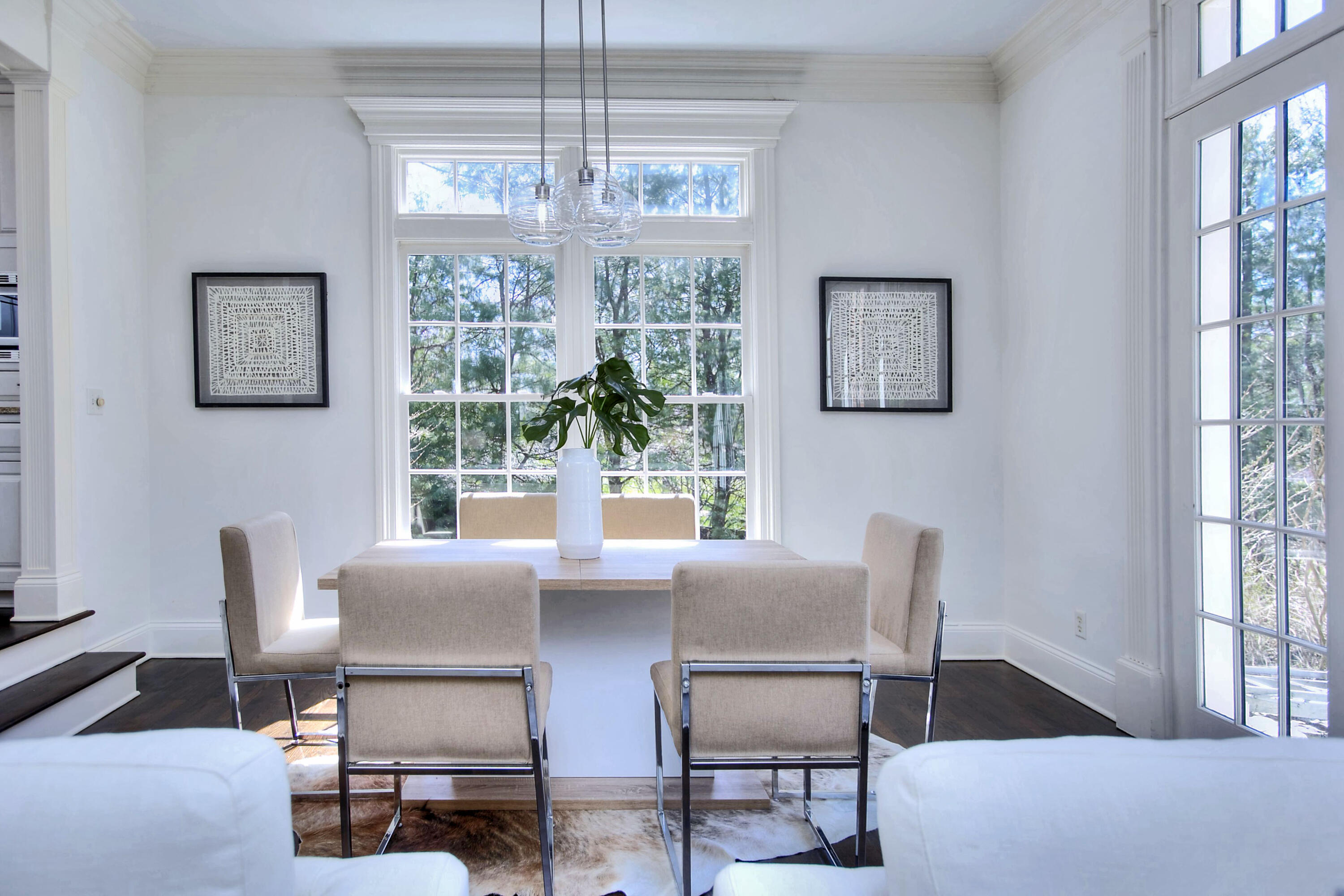 320 Ponus Ridge Road New Canaan, CT 06840 - Photo 20 of 40 a view of a dining room with furniture wooden floor and a chandelier