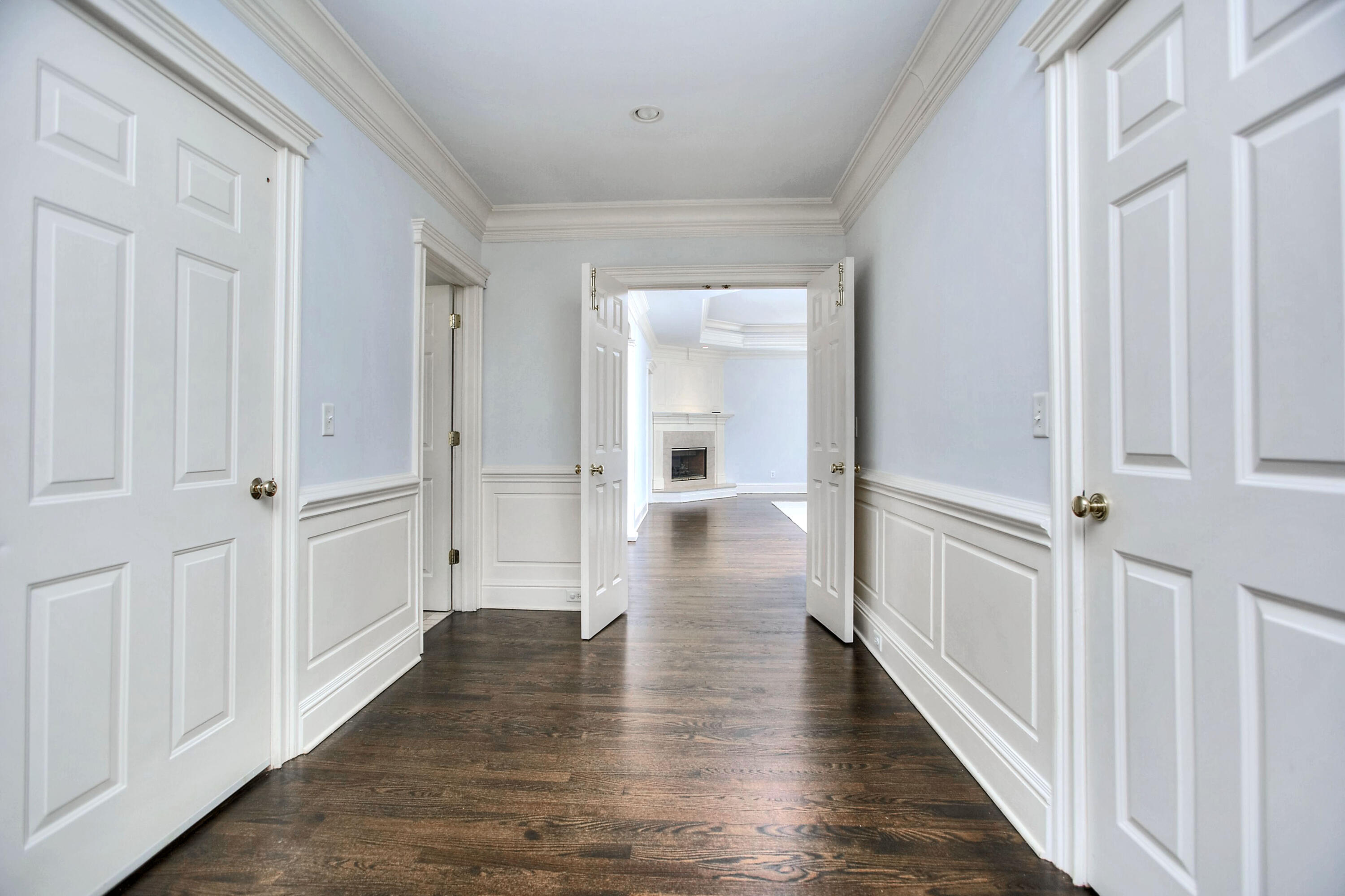 320 Ponus Ridge Road New Canaan, CT 06840 - Photo 22 of 40 a view of a hallway with wooden floor
