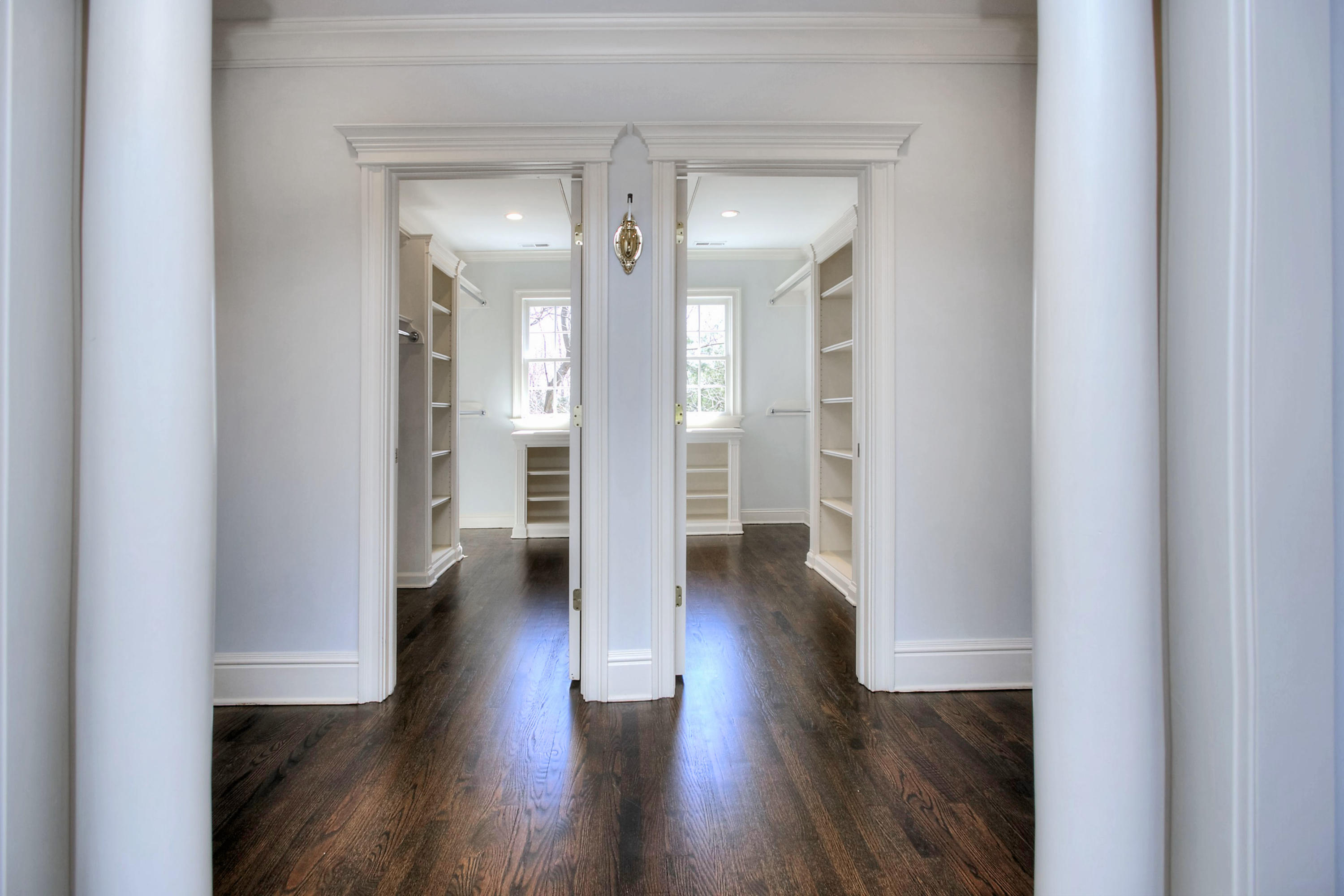320 Ponus Ridge Road New Canaan, CT 06840 - Photo 25 of 40 a view of a hallway with wooden floor and closet