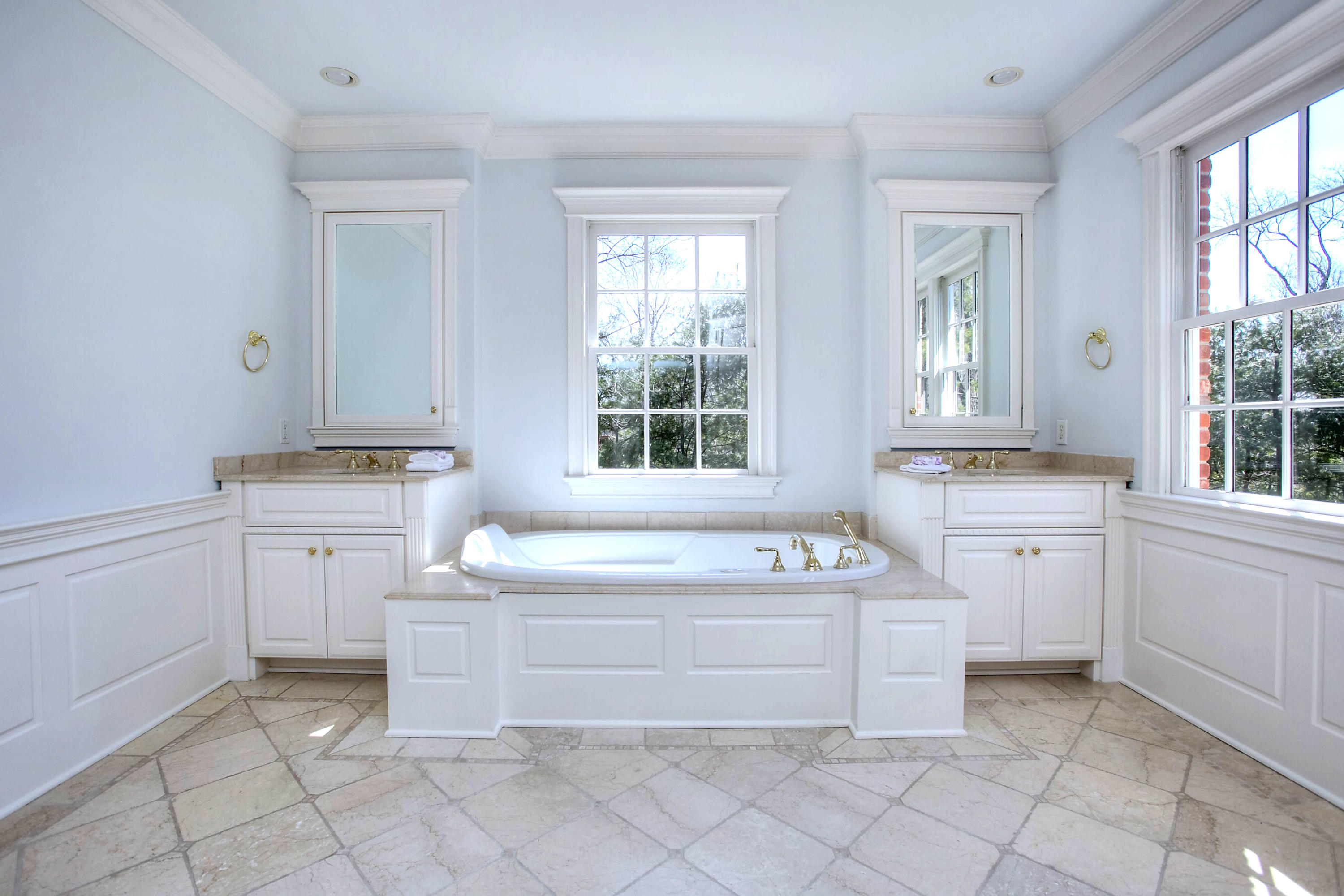 320 Ponus Ridge Road New Canaan, CT 06840 - Photo 27 of 40 a bathroom with a sink a bathtub and a window