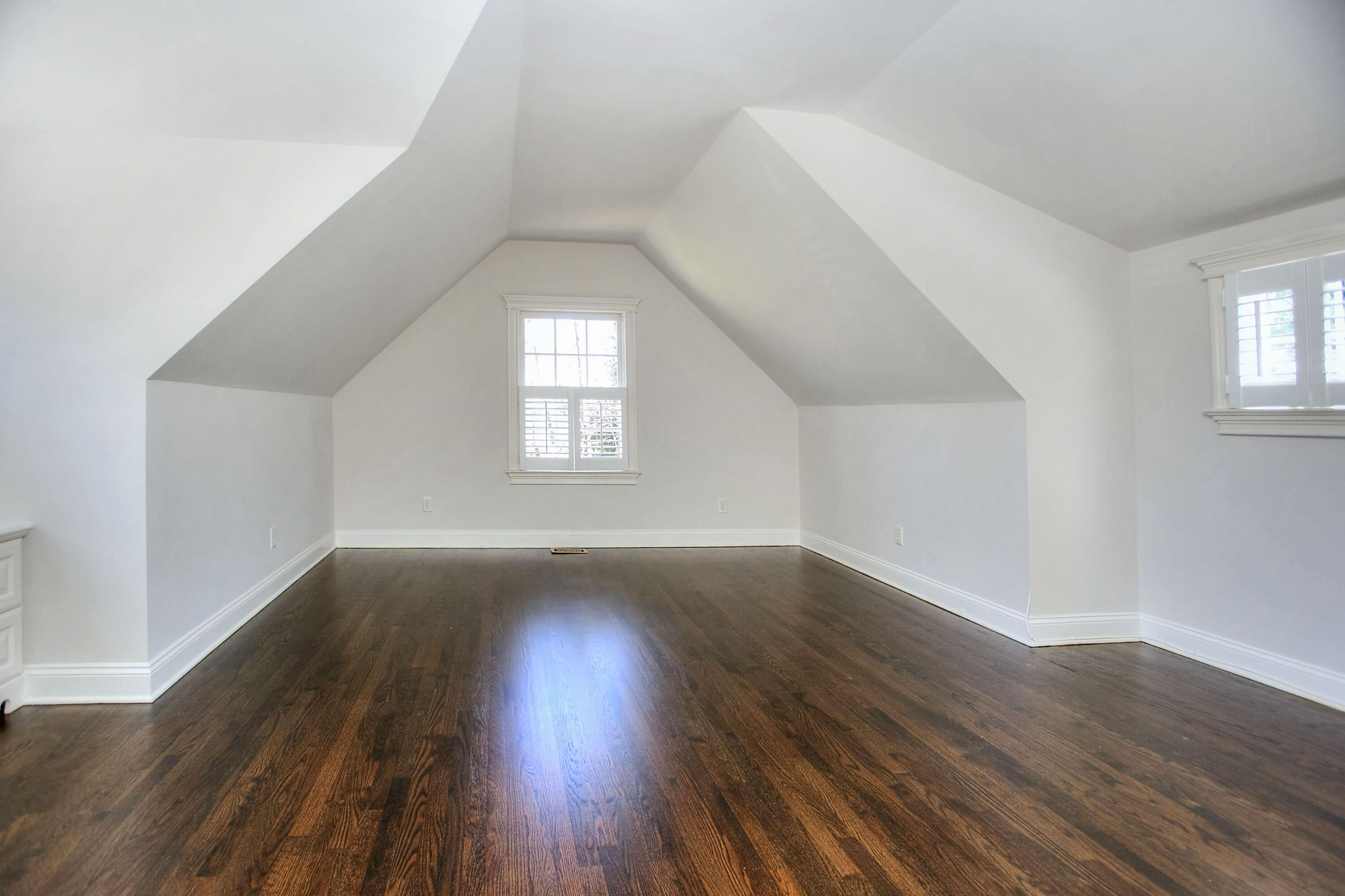 320 Ponus Ridge Road New Canaan, CT 06840 - Photo 28 of 40 an empty room with wooden floor and windows
