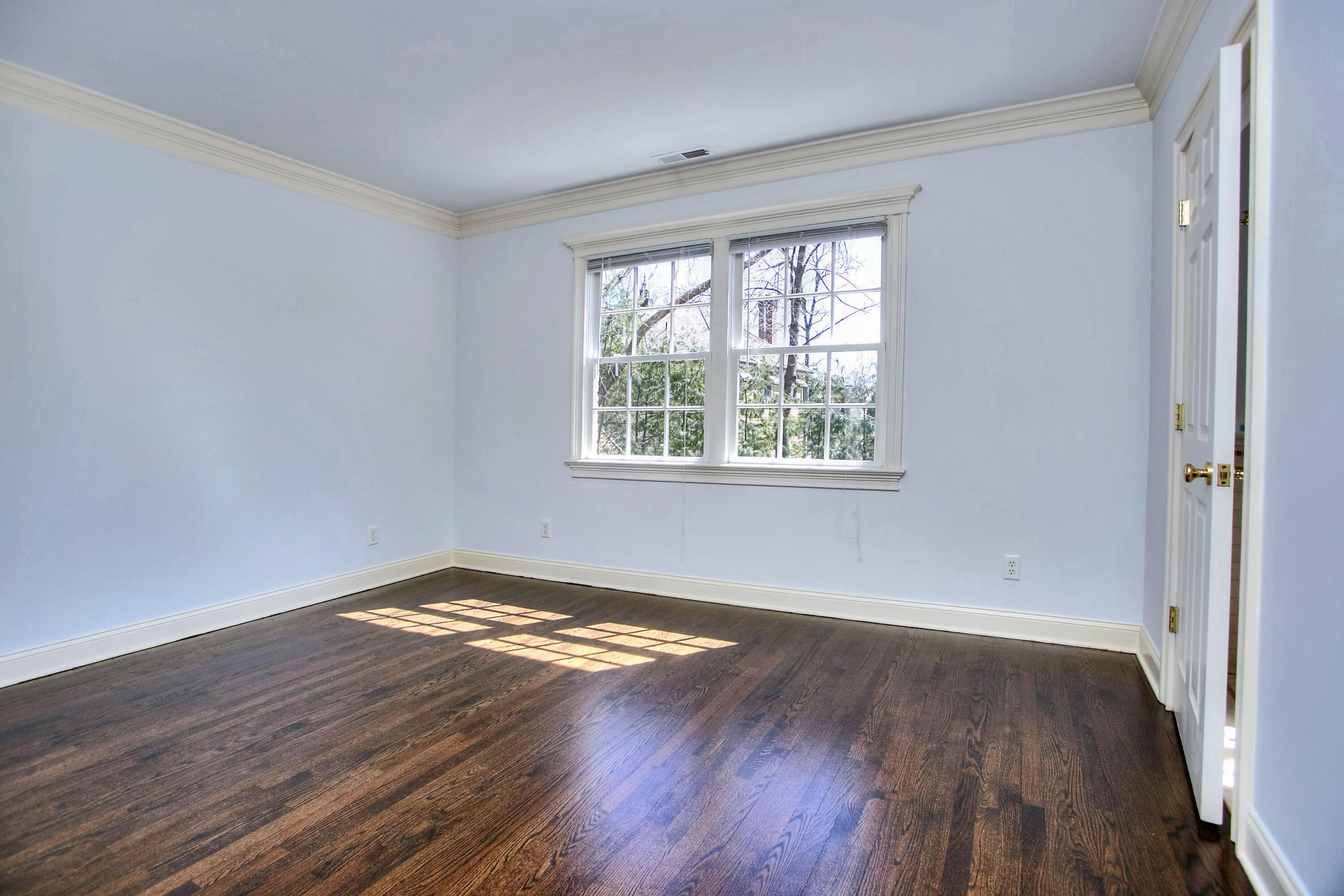 320 Ponus Ridge Road New Canaan, CT 06840 - Photo 30 of 40 a view of a room with wooden floor and window