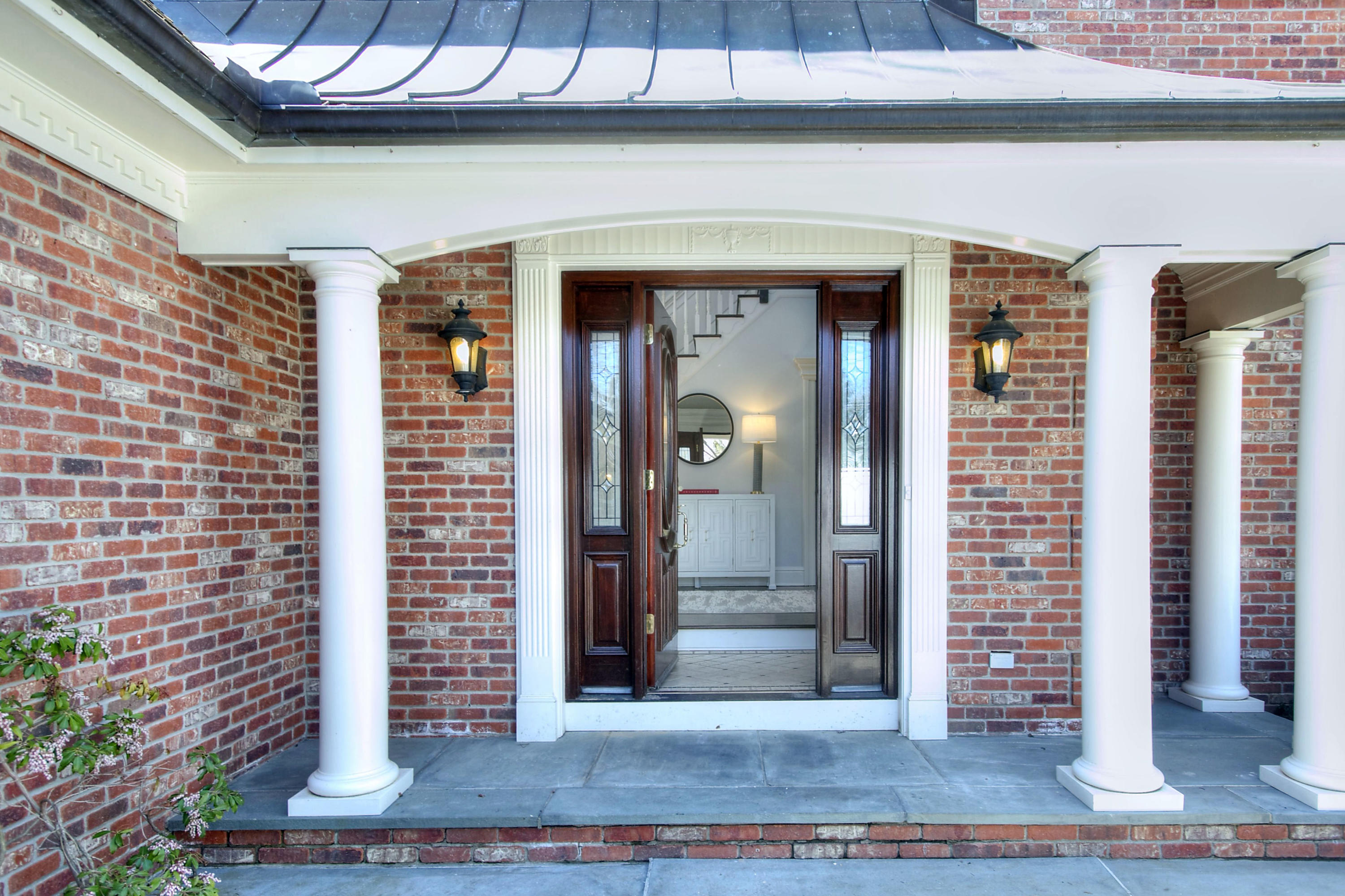 320 Ponus Ridge Road New Canaan, CT 06840 - Photo 4 of 40 a front view of a building with glass windows