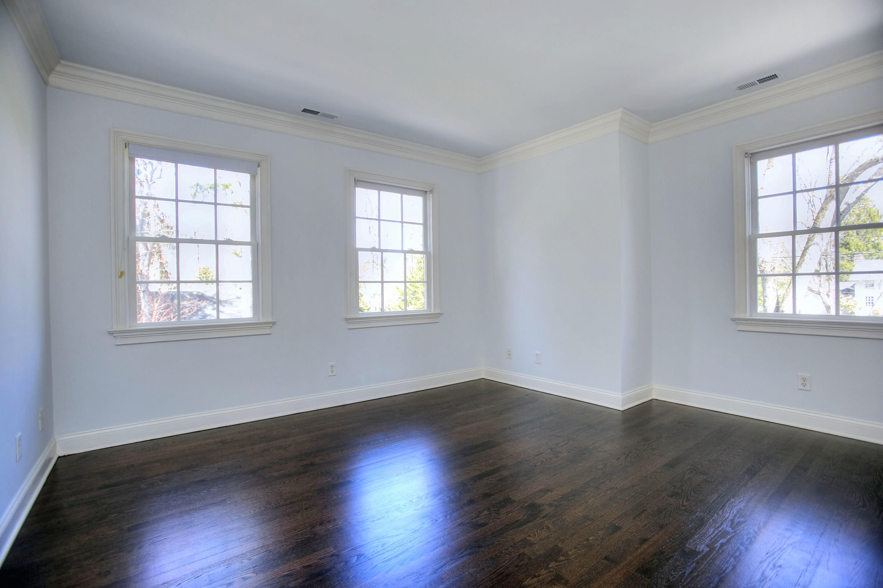 320 Ponus Ridge Road New Canaan, CT 06840 - Photo 31 of 40 a view of an empty room with wooden floor and a window
