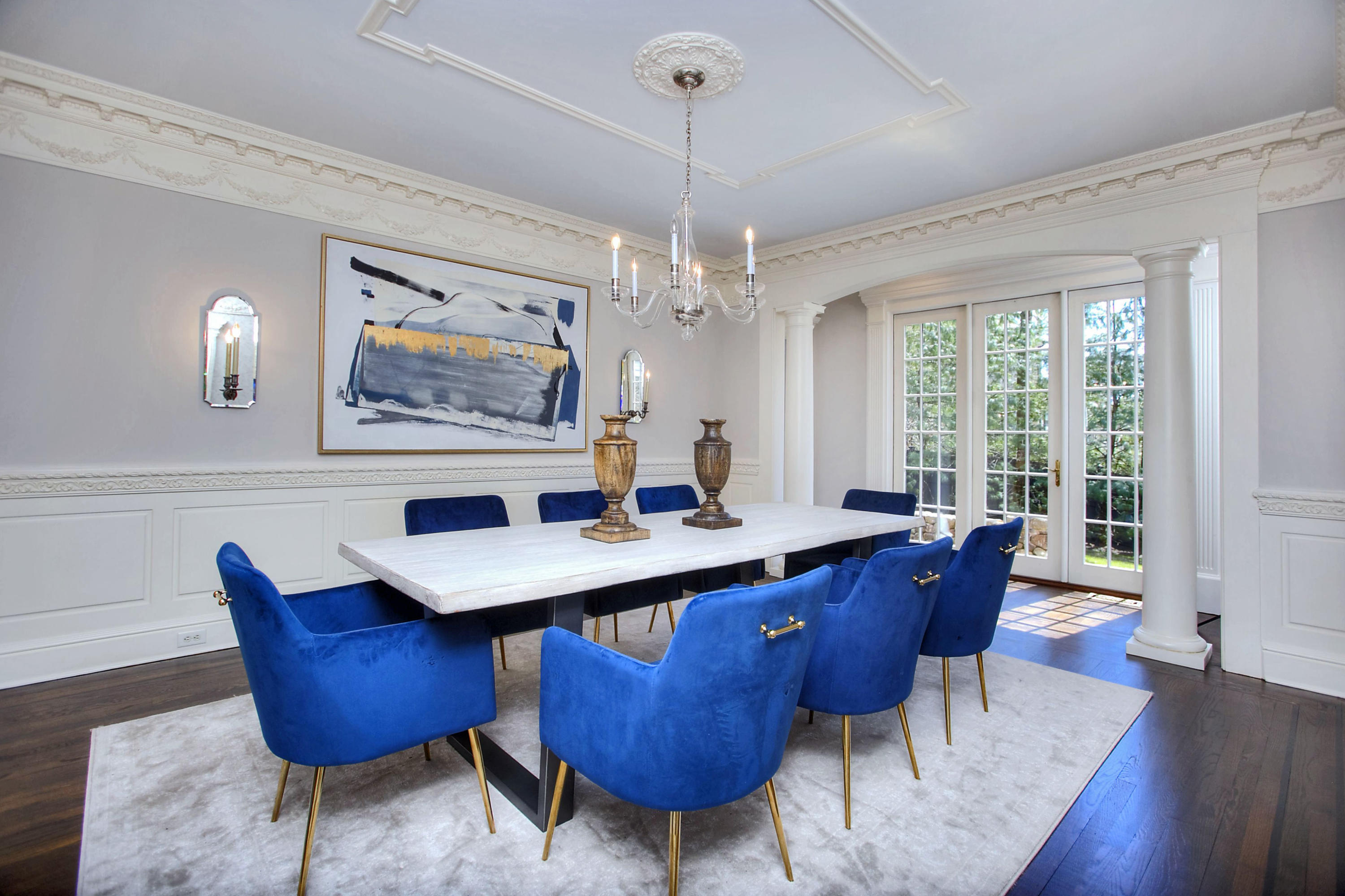 320 Ponus Ridge Road New Canaan, CT 06840 - Photo 9 of 40 a view of a dining room with furniture a chandelier and wooden floor