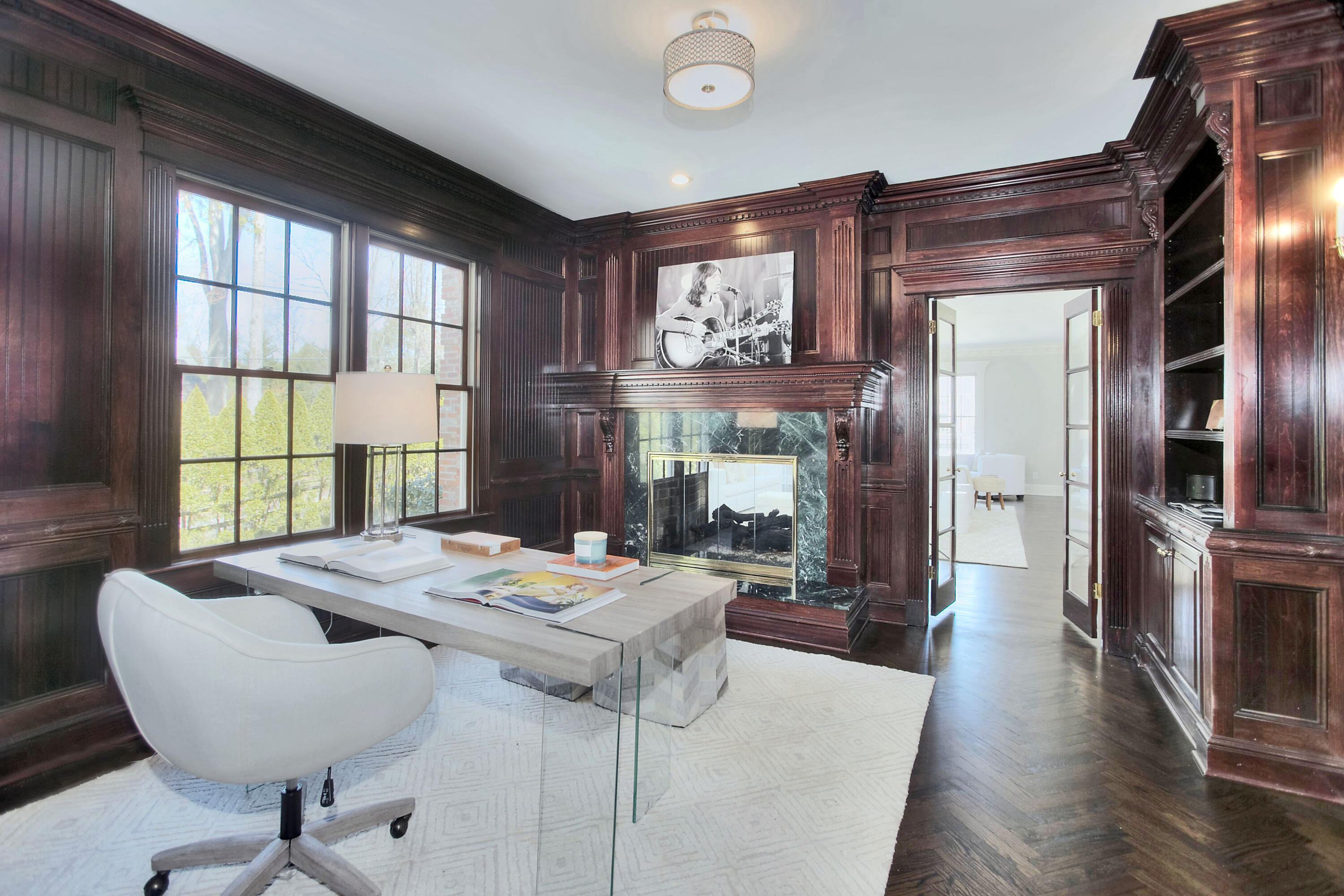 320 Ponus Ridge Road New Canaan, CT 06840 - Photo 10 of 40 a view of a dining room with furniture window and wooden floor