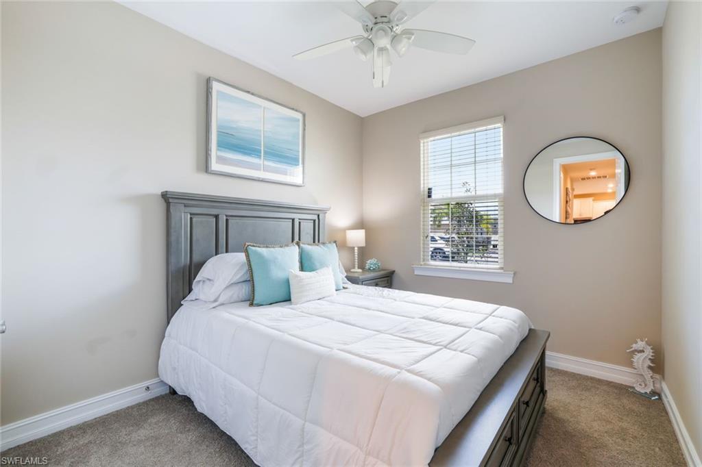 1116 Rolling Brook Lane Naples, FL 34114 - Photo 13 of 22 a bedroom with a bed and a window