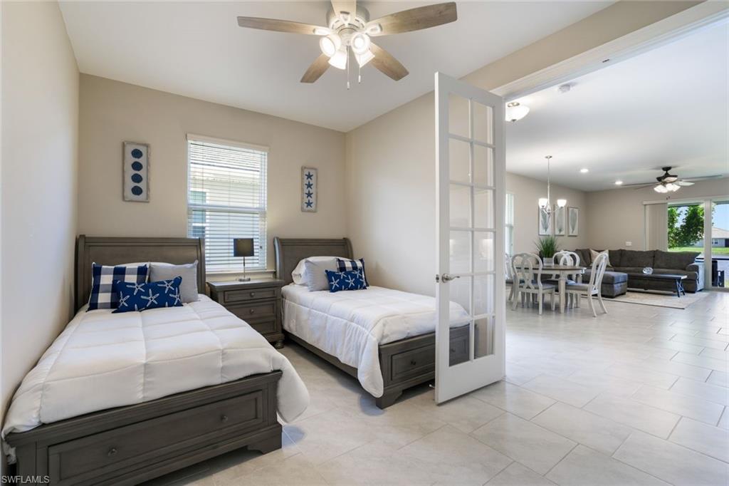 1116 Rolling Brook Lane Naples, FL 34114 - Photo 15 of 22 a living room with furniture and a chandelier