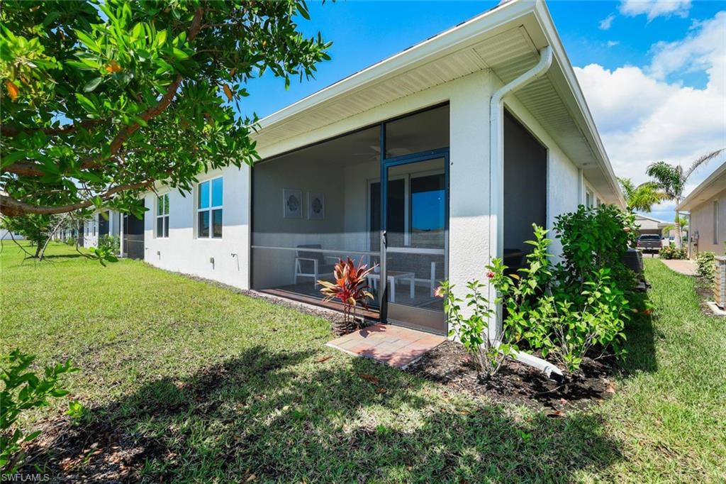 1116 Rolling Brook Lane Naples, FL 34114 - Photo 17 of 22 a view of a backyard with sitting area