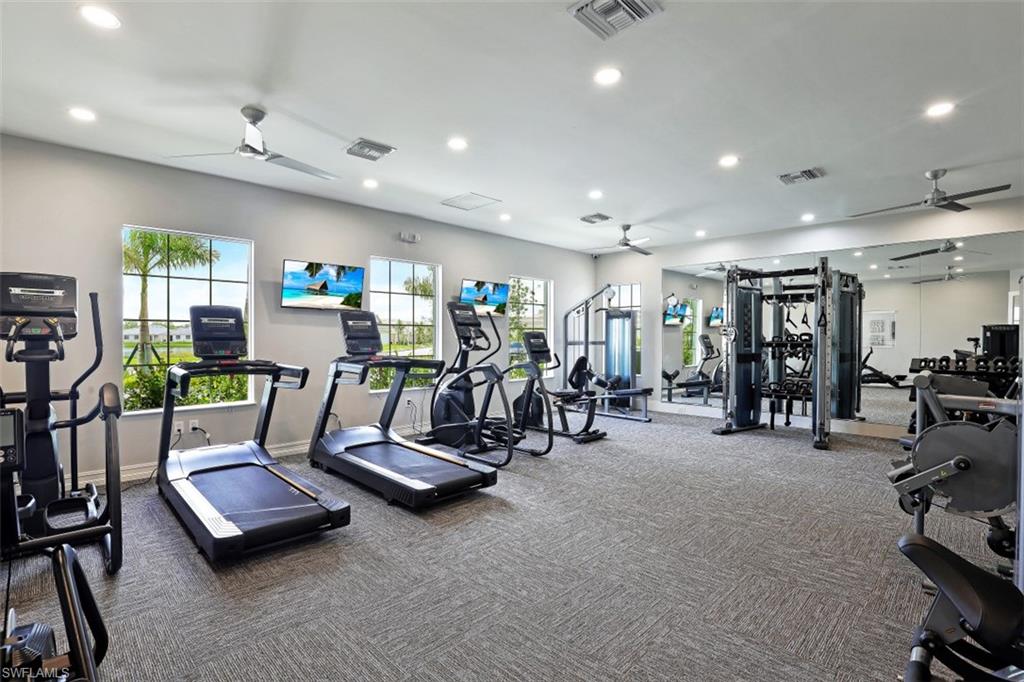 1116 Rolling Brook Lane Naples, FL 34114 - Photo 19 of 22 a view of a room with gym equipment