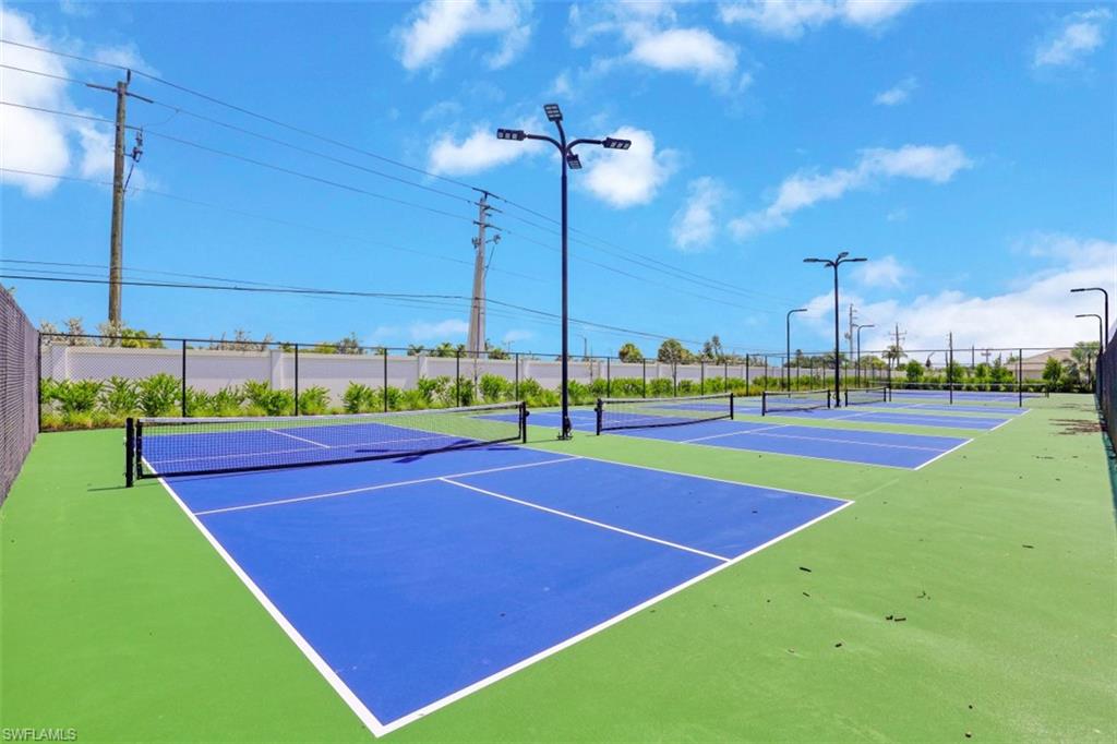1116 Rolling Brook Lane Naples, FL 34114 - Photo 22 of 22 a view of an outdoor space and tennis court