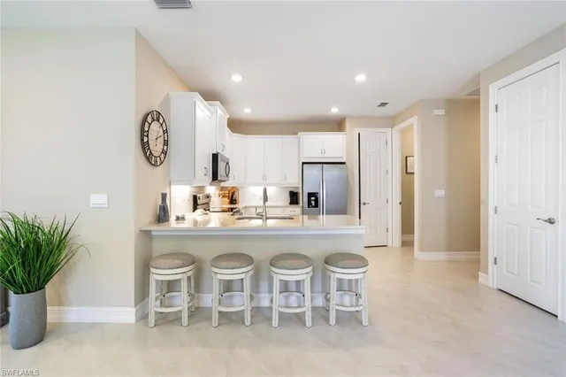 a kitchen with a table and chairs in it