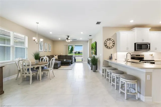 a large kitchen with a table and chairs