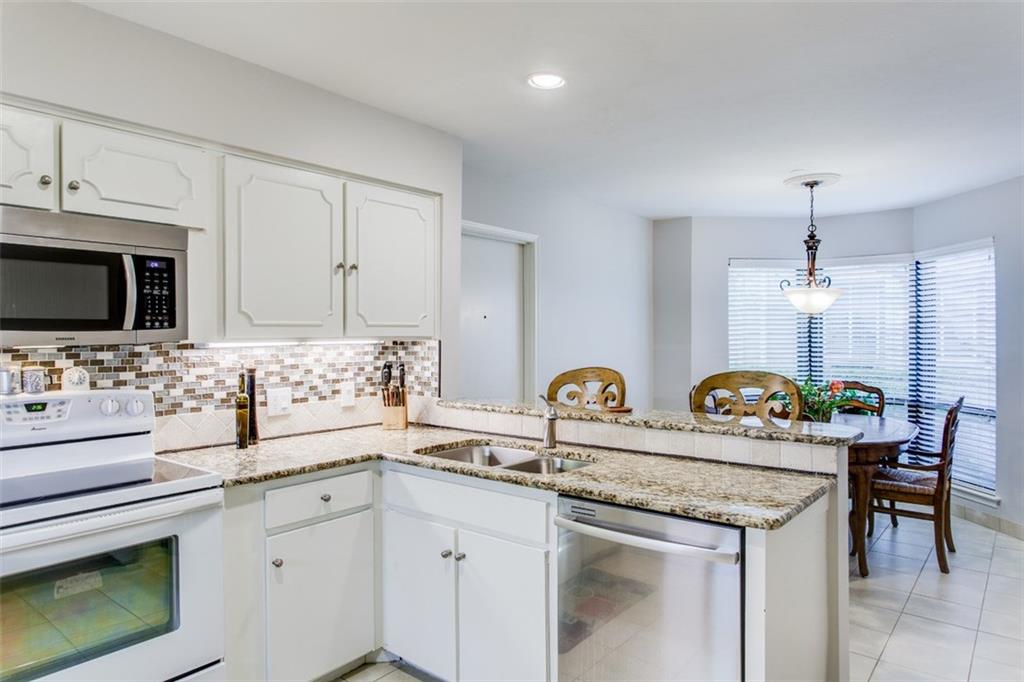 6357 Diamond Head Circle, Unit B Dallas, TX 75225 - Photo 13 of 23 Breakfast Area with windows to back yard