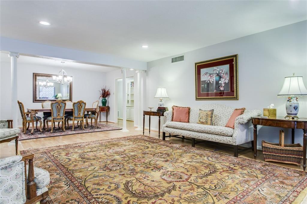 6357 Diamond Head Circle, Unit B Dallas, TX 75225 - Photo 5 of 23 LR - DR combo. Flooring has been replaced with LVP