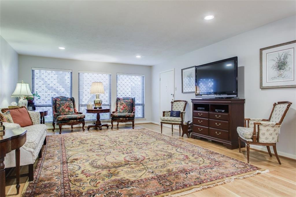 6357 Diamond Head Circle, Unit B Dallas, TX 75225 - Photo 7 of 23 LR - DR combo. Flooring has been replaced with LVP