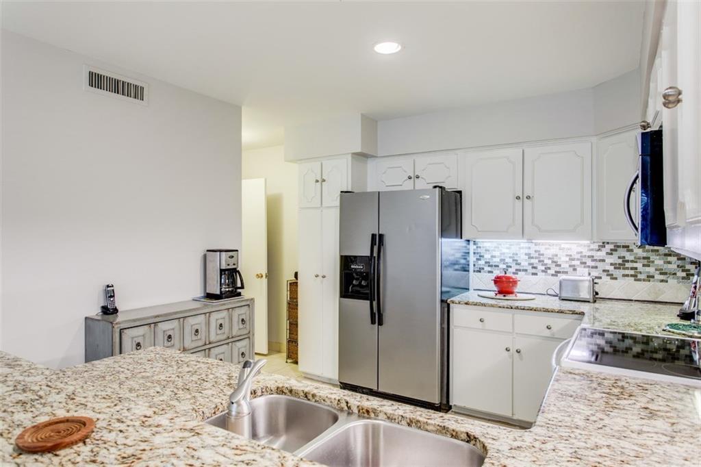 6357 Diamond Head Circle, Unit B Dallas, TX 75225 - Photo 9 of 23 Refrigerator is furnished