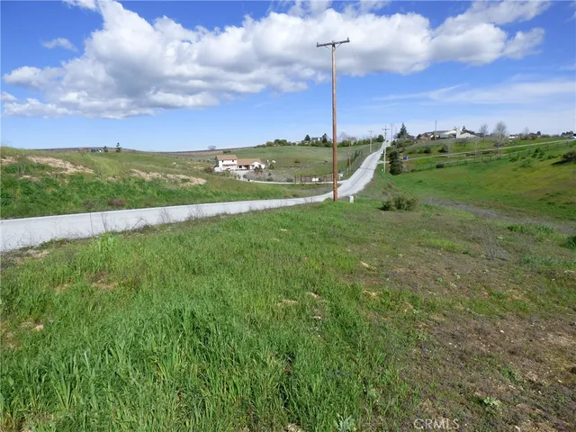 a view of a city with lush green forest