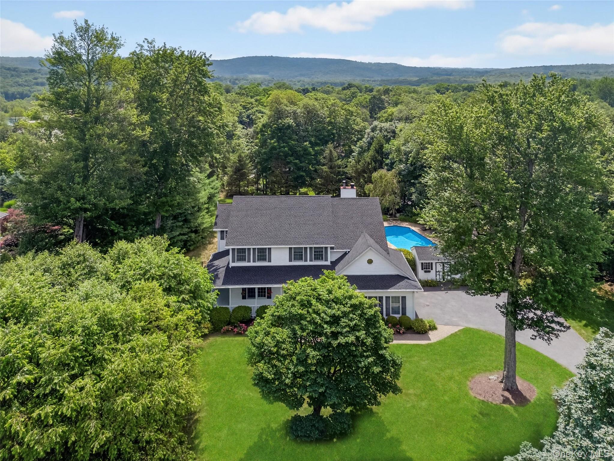 23 Cranberry Pond Road Putnam Valley, NY 10579 - Photo 1 of 1 an aerial view of a house with garden space and street view