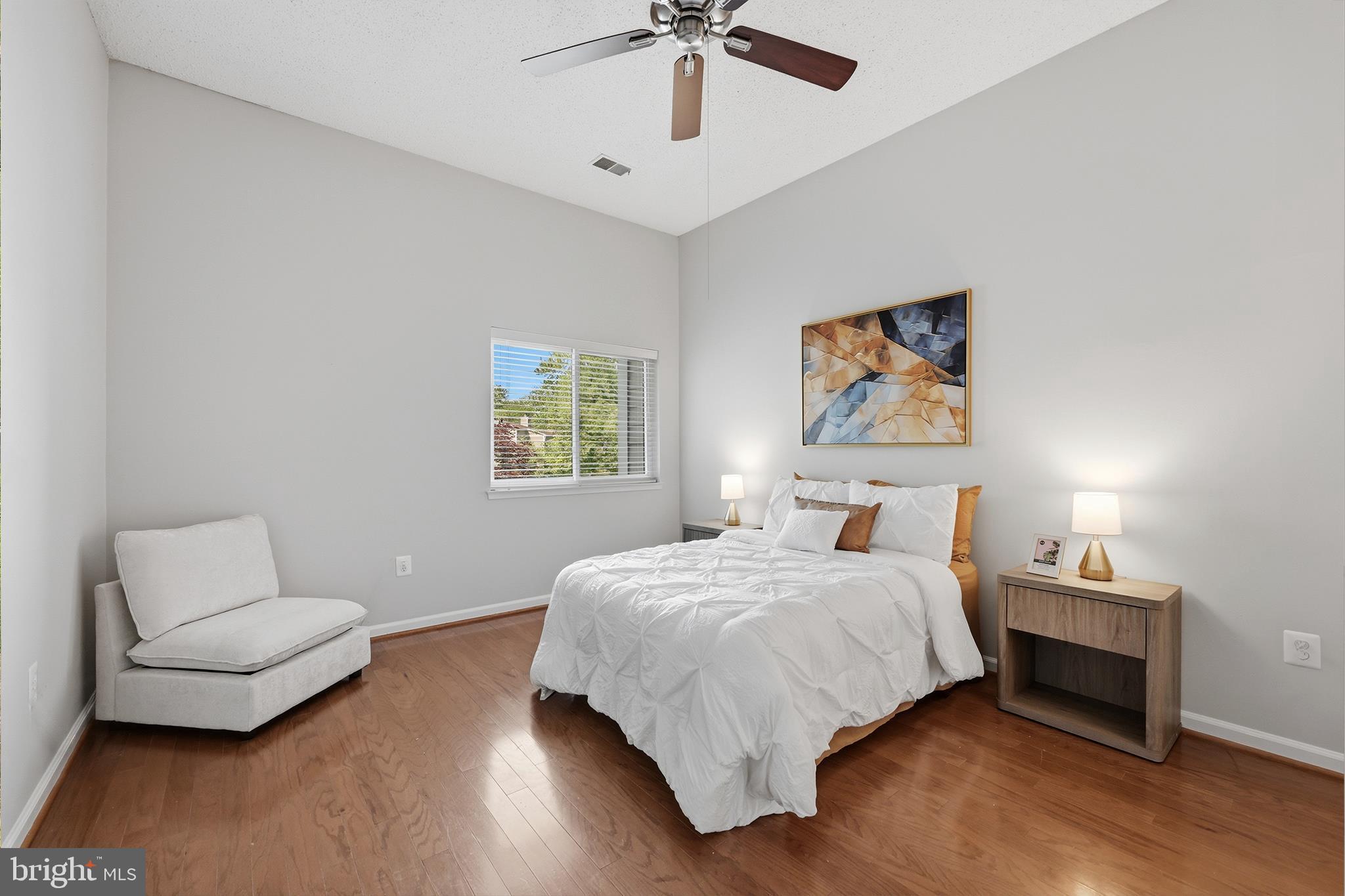 1907 Villaridge Drive Reston, VA 20191 - Photo 11 of 32 a bedroom with a bed and a couch