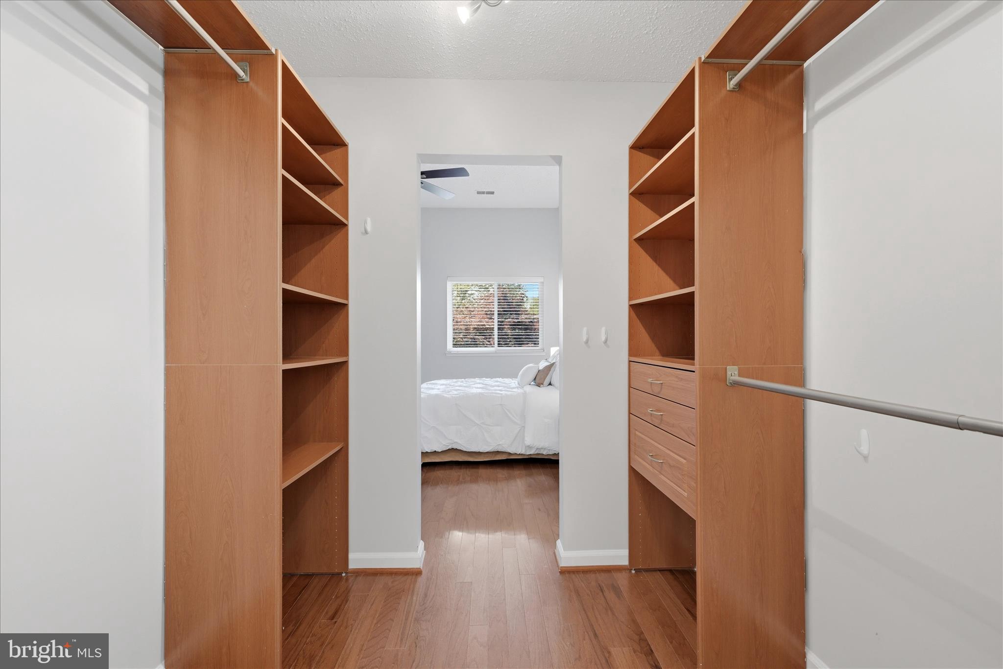 1907 Villaridge Drive Reston, VA 20191 - Photo 15 of 32 a view of walk in closet with wooden floor