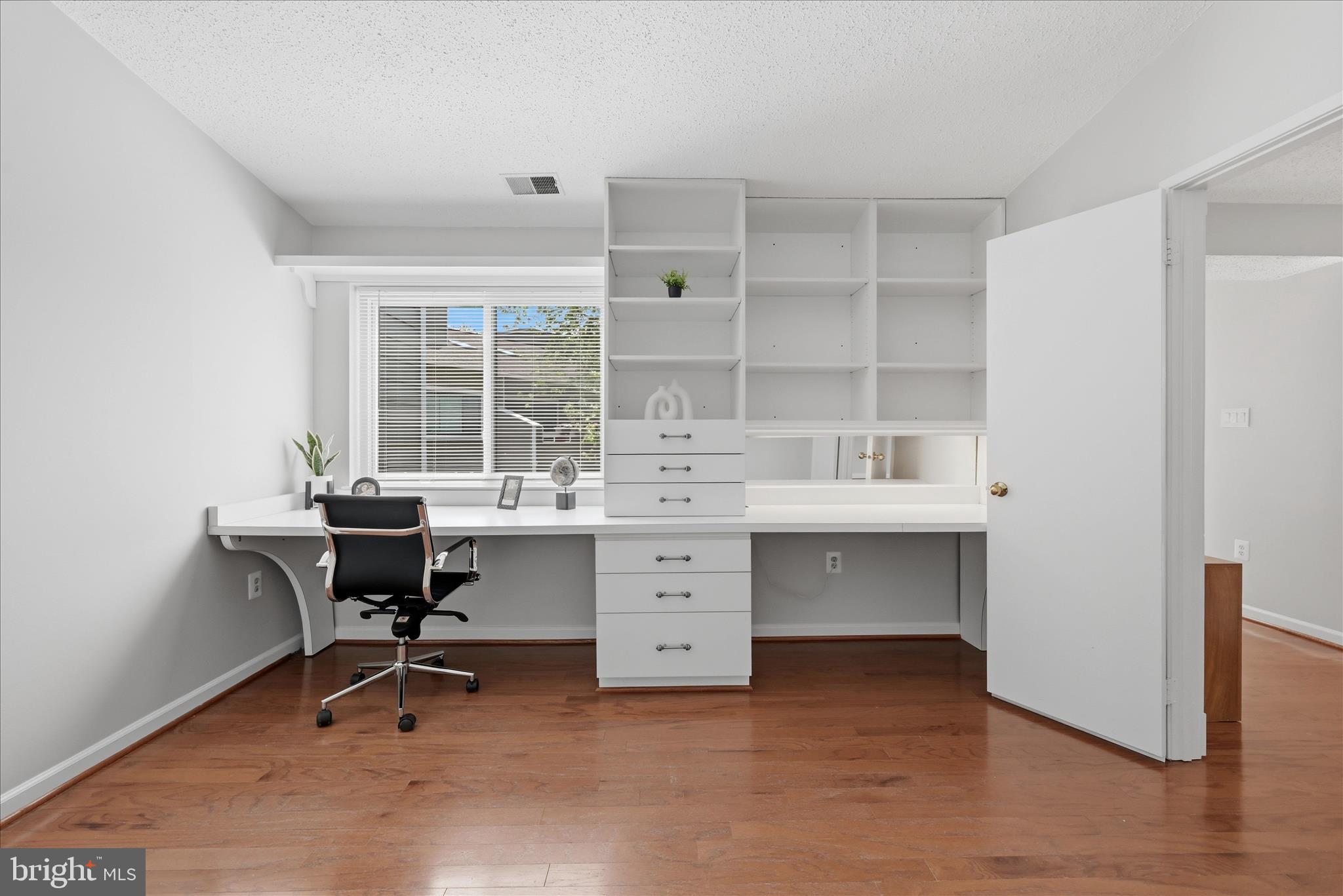 1907 Villaridge Drive Reston, VA 20191 - Photo 16 of 32 a view of a workspace with furniture and a window