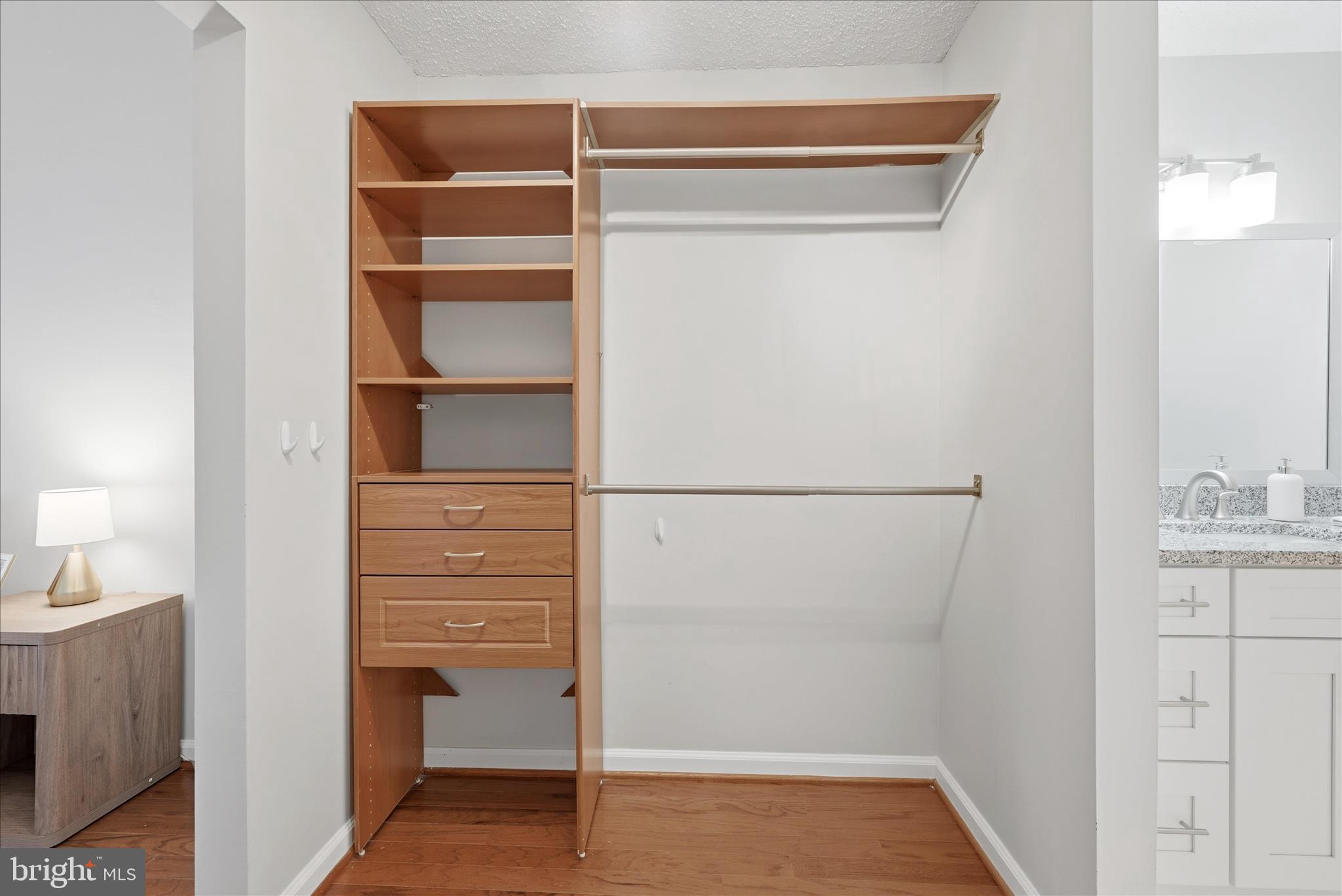 1907 Villaridge Drive Reston, VA 20191 - Photo 25 of 32 a view of walk in closet with empty racks