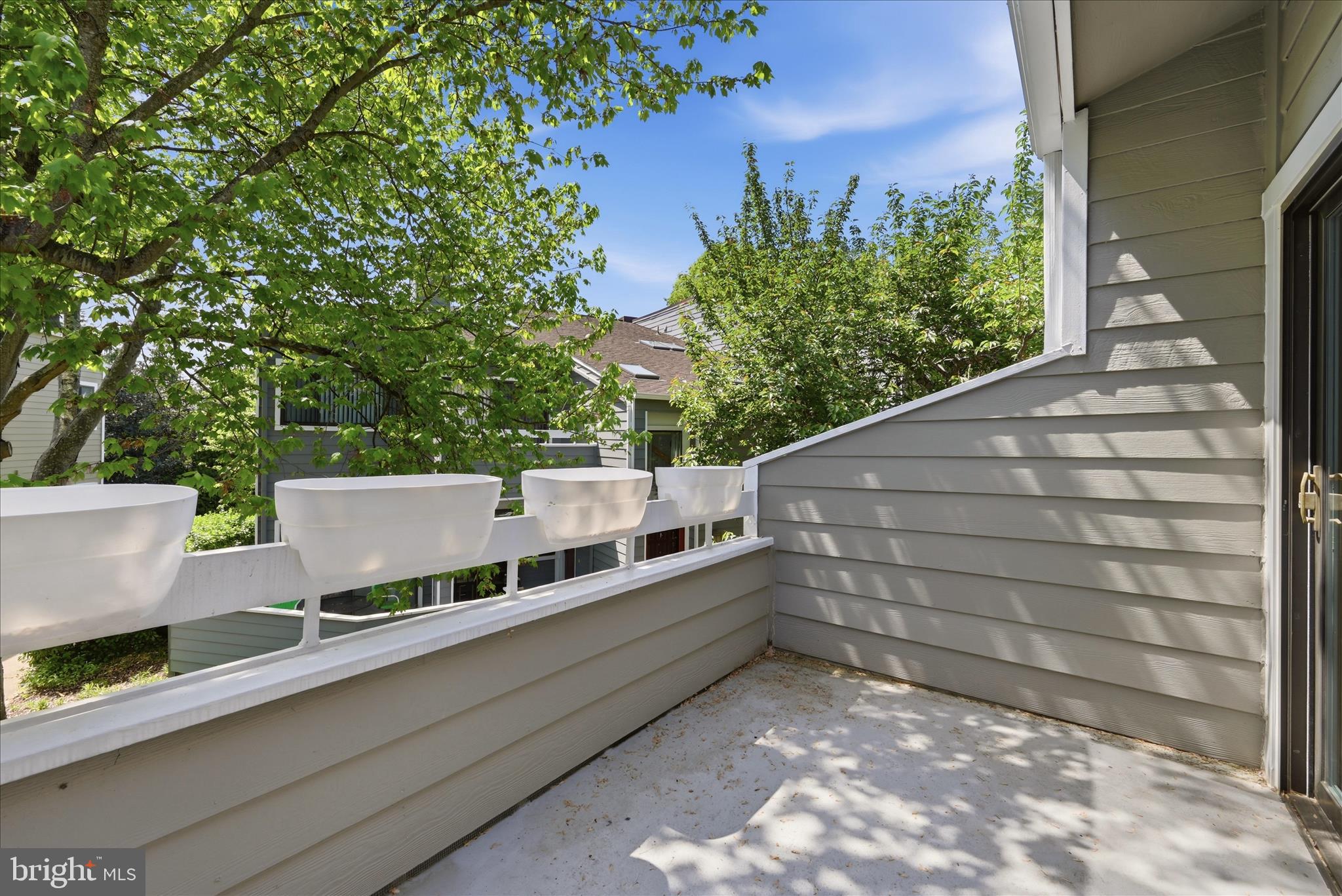1907 Villaridge Drive Reston, VA 20191 - Photo 27 of 32 a view of a terrace with a bench