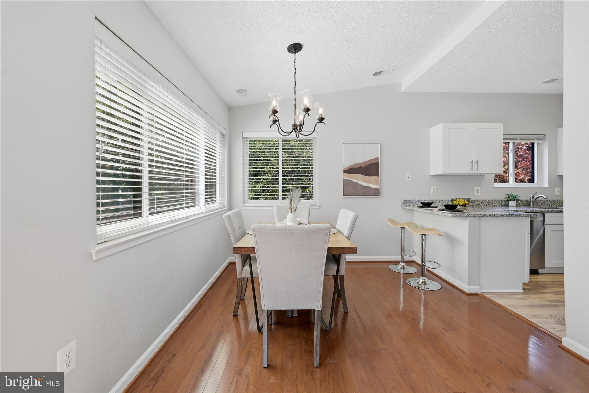1907 Villaridge Drive Reston, VA 20191 - Photo 6 of 32 a view of a dining room with furniture window and wooden floor