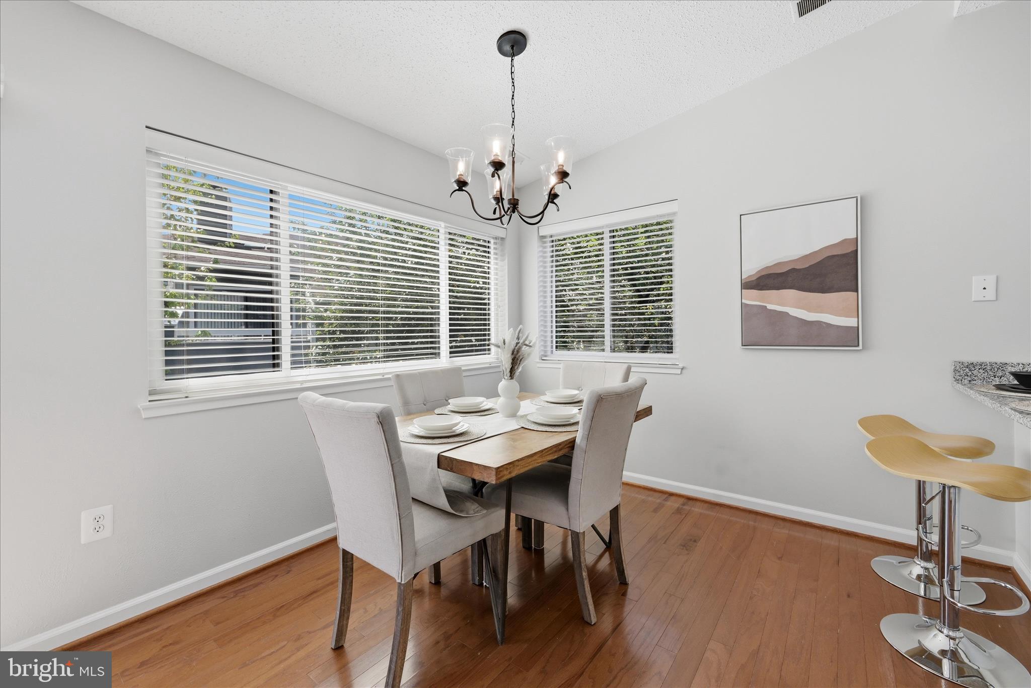 1907 Villaridge Drive Reston, VA 20191 - Photo 7 of 32 a view of a dining room with furniture window and wooden floor