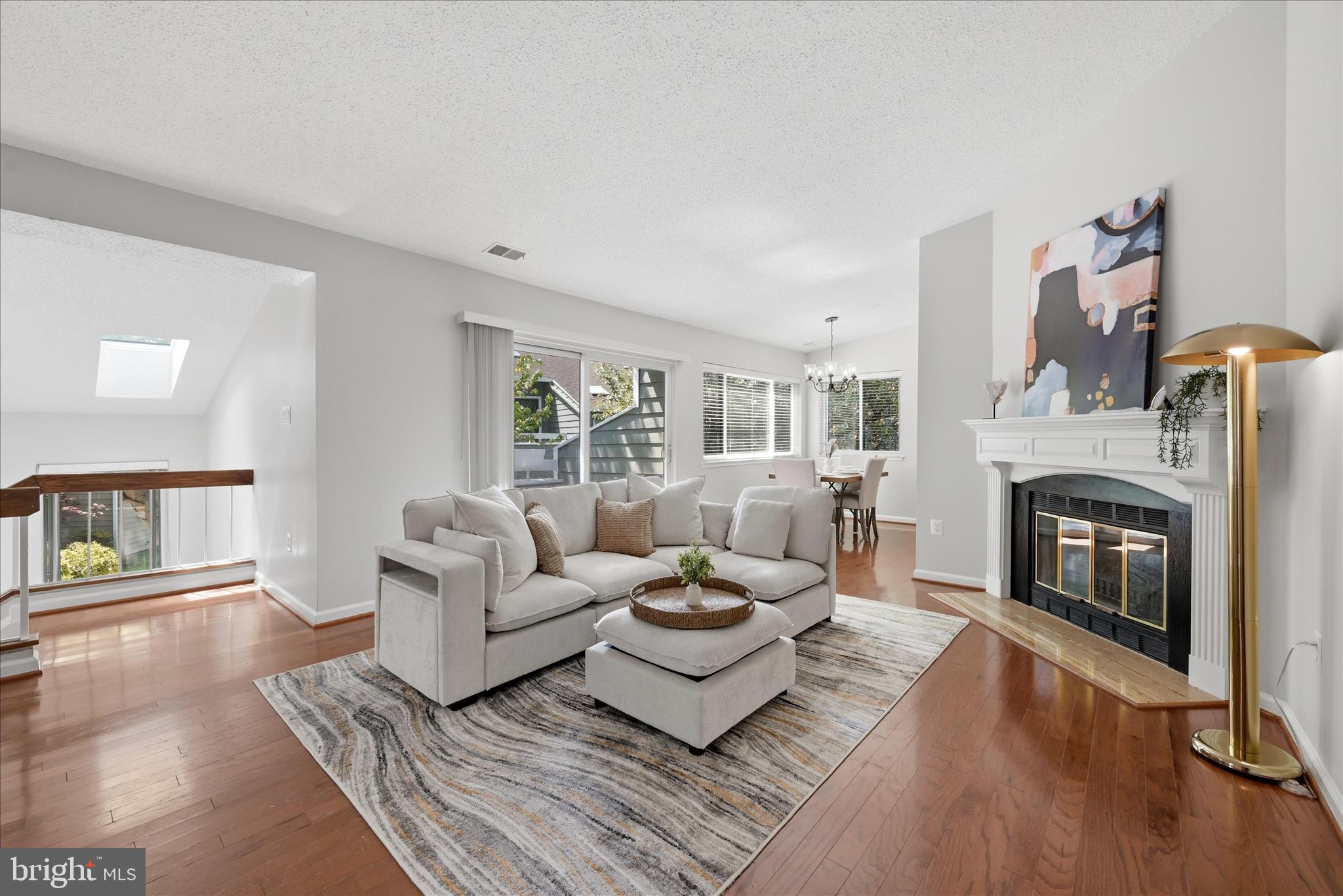 1907 Villaridge Drive Reston, VA 20191 - Photo 8 of 32 a living room with furniture and a fireplace