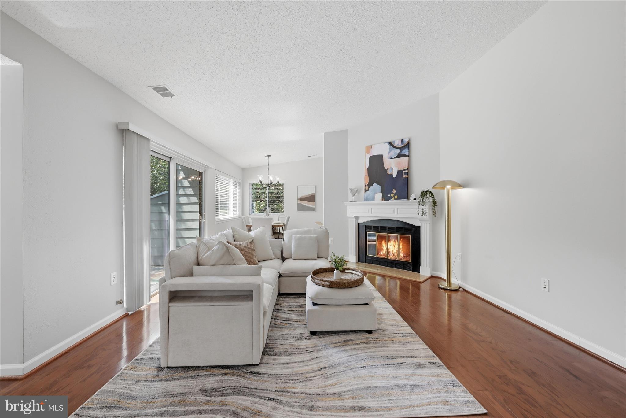 1907 Villaridge Drive Reston, VA 20191 - Photo 10 of 32 a living room with furniture and a fireplace