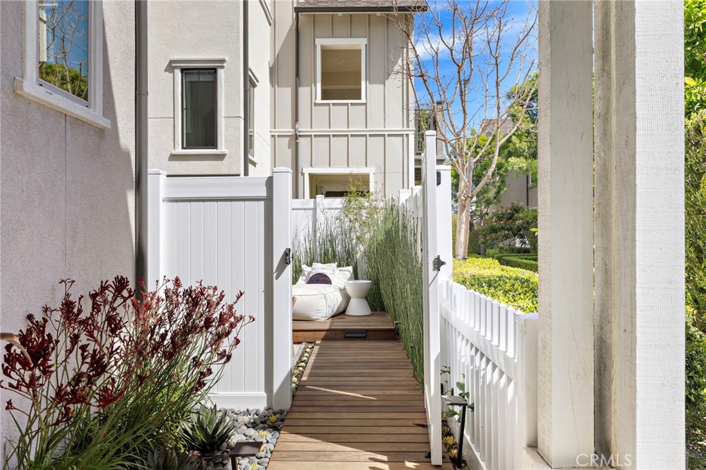 26 Yerra Street Rancho Mission Viejo, CA 92694 - Photo 12 of 75 Private side path leading to a tranquil outdoor lounge.