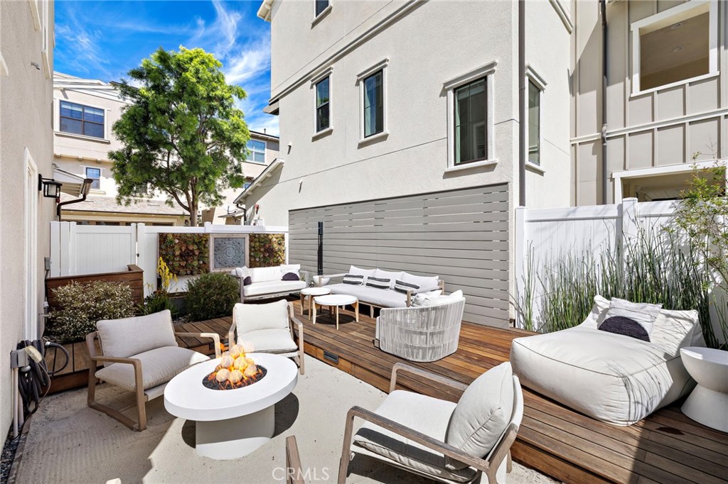 26 Yerra Street Rancho Mission Viejo, CA 92694 - Photo 13 of 75 a backyard of a house with fire pit and outdoor seating