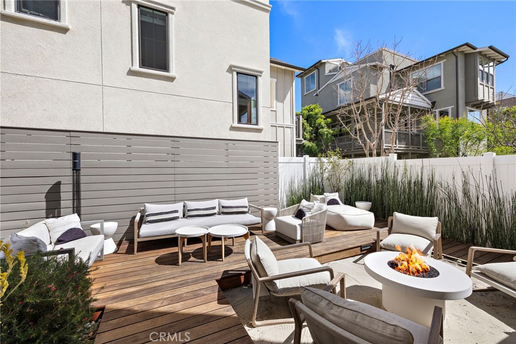 26 Yerra Street Rancho Mission Viejo, CA 92694 - Photo 14 of 75 a backyard of a house with wooden floor and outdoor seating