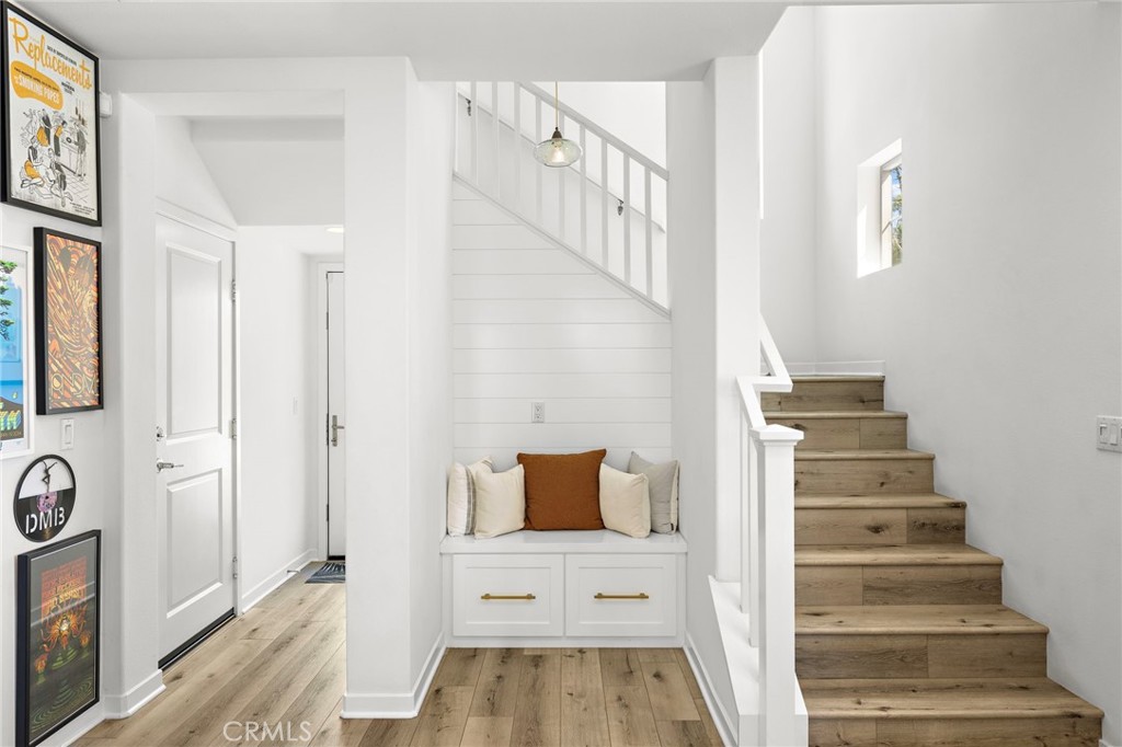 26 Yerra Street Rancho Mission Viejo, CA 92694 - Photo 21 of 75 a view of a hallway with wooden floor and staircase