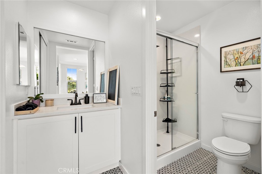 26 Yerra Street Rancho Mission Viejo, CA 92694 - Photo 25 of 75 a bathroom with a sink a toilet and shower