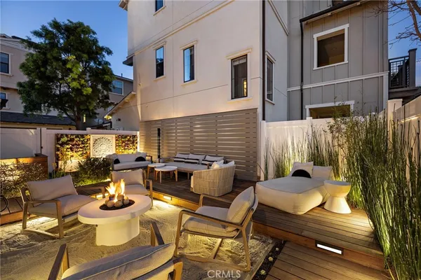 a view of a patio with chairs and a table