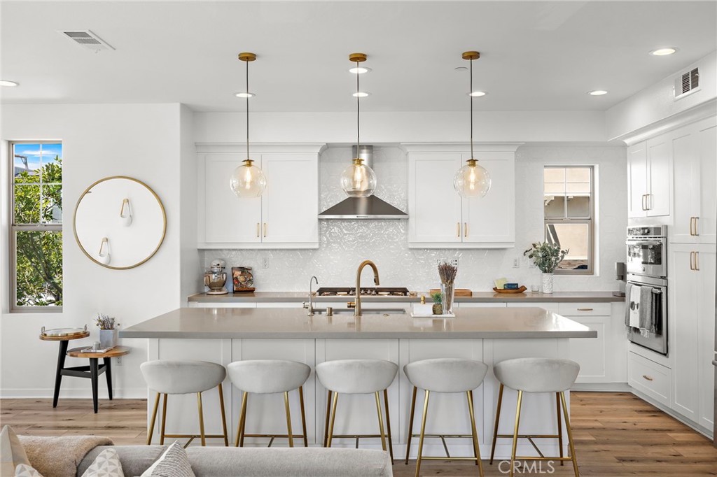 26 Yerra Street Rancho Mission Viejo, CA 92694 - Photo 37 of 75 Expansive island anchoring a bright, thoughtfully designed kitchen.