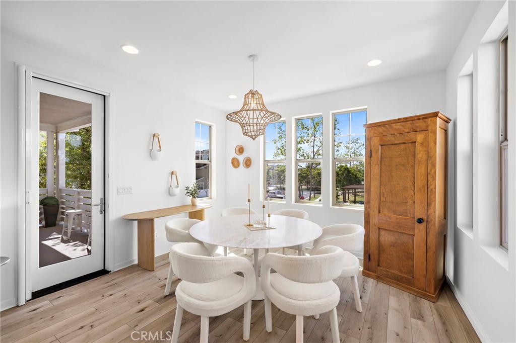 26 Yerra Street Rancho Mission Viejo, CA 92694 - Photo 40 of 75 a dining room with furniture window and wooden floor