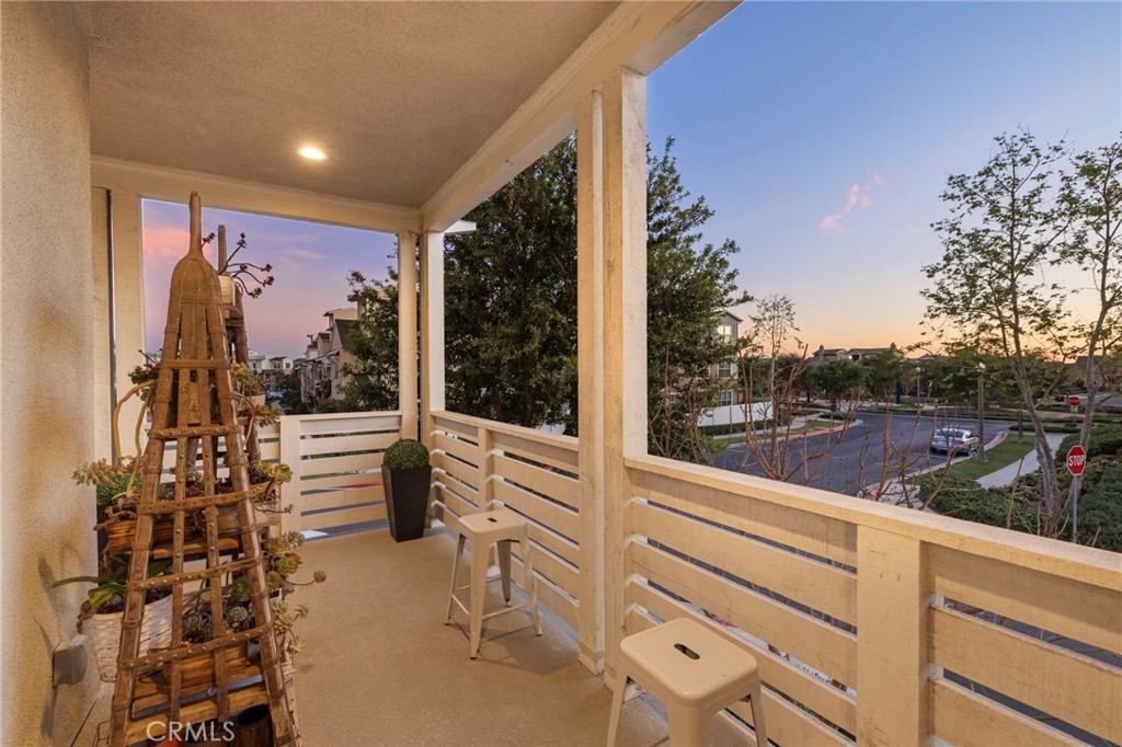 26 Yerra Street Rancho Mission Viejo, CA 92694 - Photo 44 of 75 Twilight balcony with warm tones and serene evening atmosphere.