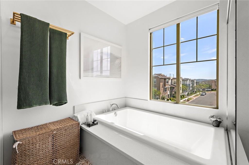 26 Yerra Street Rancho Mission Viejo, CA 92694 - Photo 49 of 75 Primary bath soaking tub complemented by natural light and spa-like design.