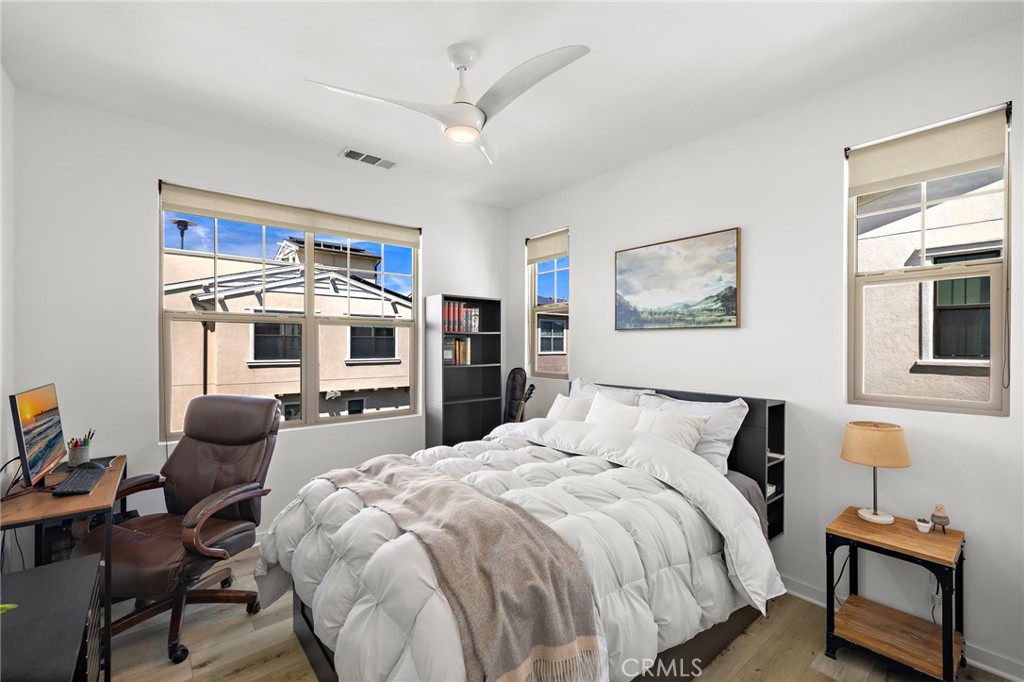 26 Yerra Street Rancho Mission Viejo, CA 92694 - Photo 50 of 75 a bedroom with a bed and wooden floor