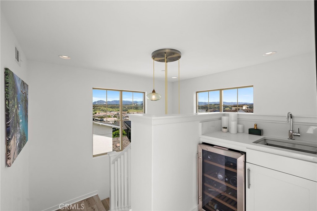 26 Yerra Street Rancho Mission Viejo, CA 92694 - Photo 53 of 75 a kitchen with stainless steel appliances a sink cabinets and a window