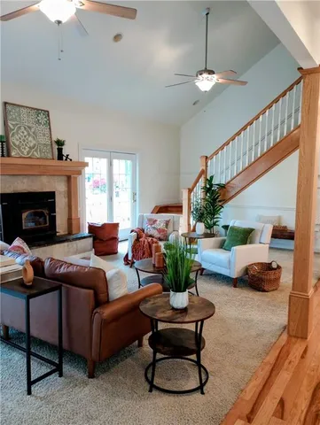 a living room with furniture potted plant and a fireplace