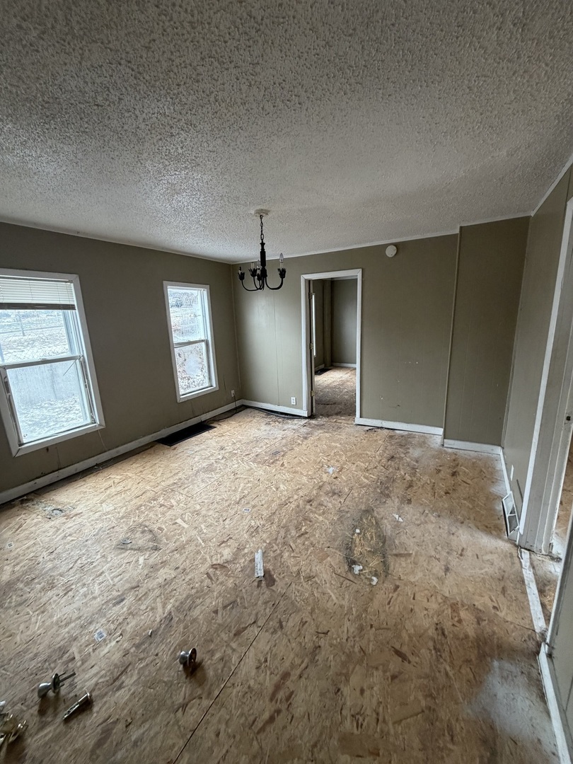 439 5th Avenue Moline, IL 61265 - Photo 14 of 16 a view of empty room with window and fireplace