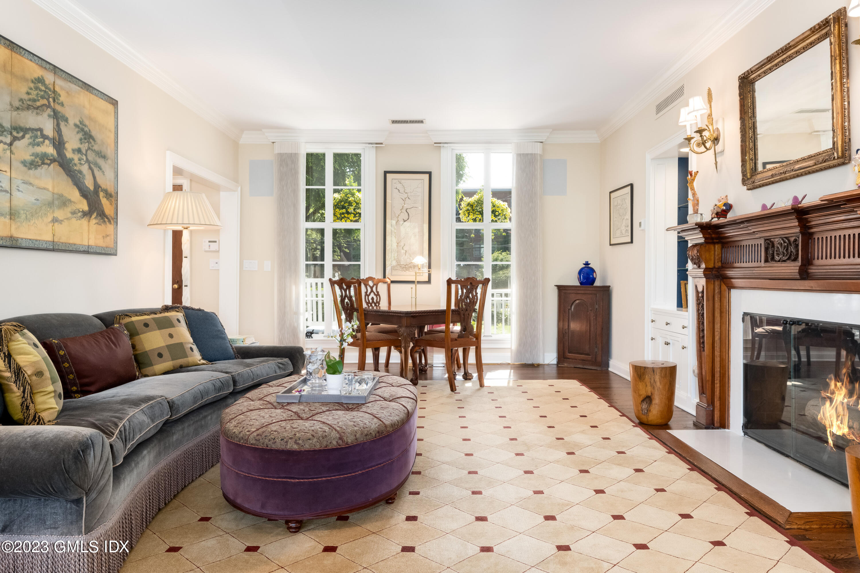 633 Steamboat Road, Unit 2 Greenwich, CT 06830 - Photo 13 of 27 a living room with furniture and a fireplace