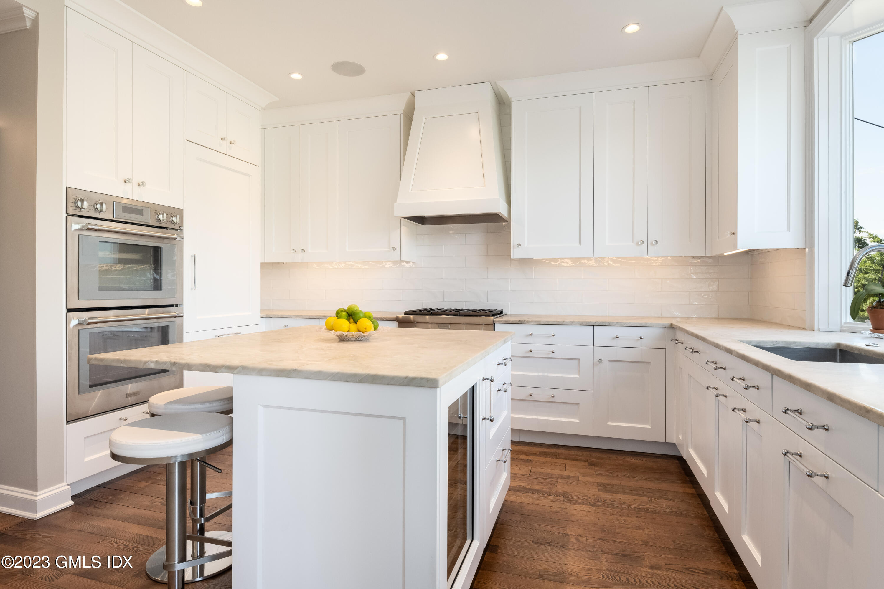 633 Steamboat Road, Unit 2 Greenwich, CT 06830 - Photo 19 of 27 a kitchen with a sink a stove a refrigerator and white cabinets