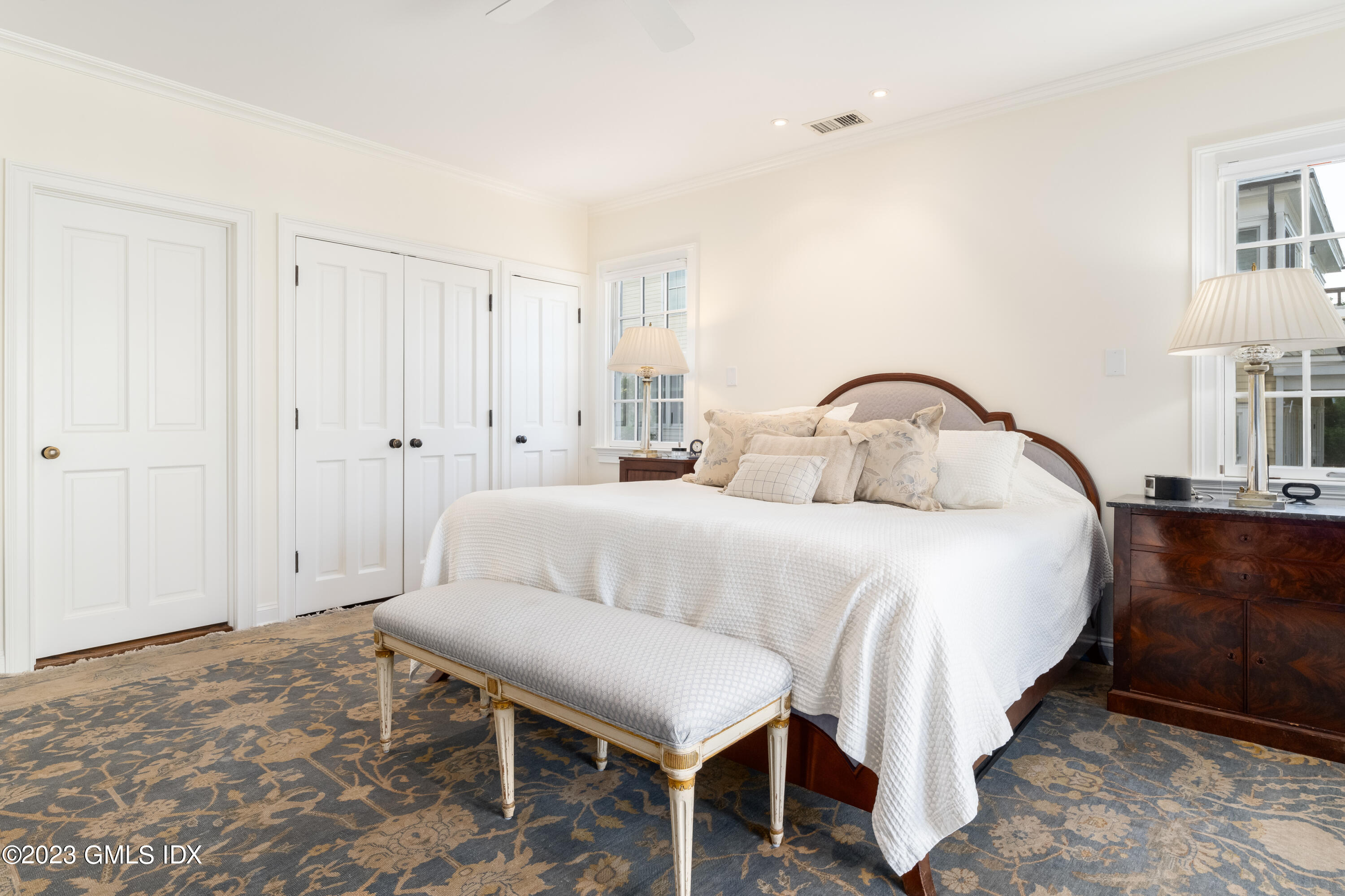633 Steamboat Road, Unit 2 Greenwich, CT 06830 - Photo 20 of 27 a bedroom with a bed and a table