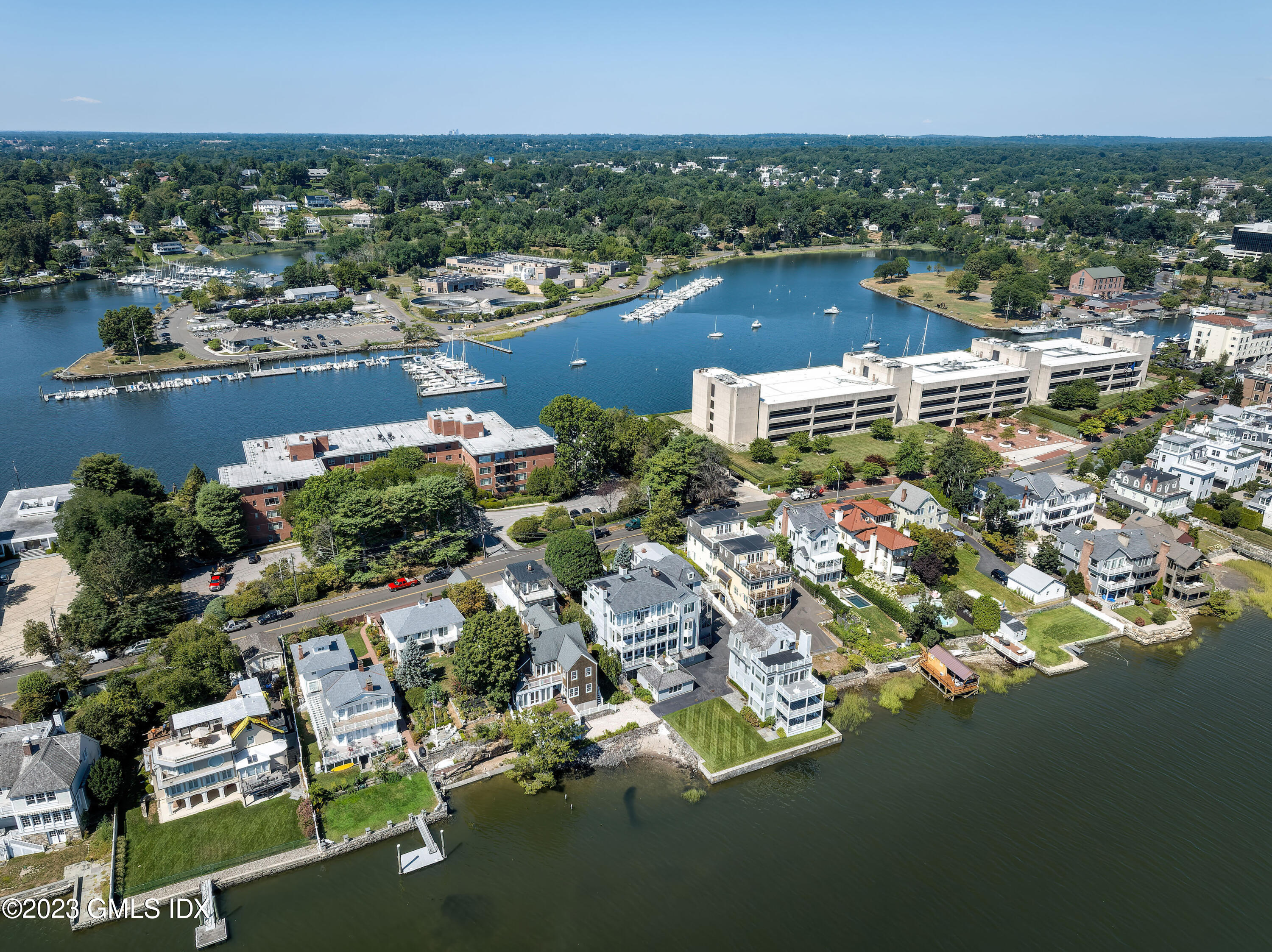633 Steamboat Road, Unit 2 Greenwich, CT 06830 - Photo 2 of 27 an aerial view of residential houses with outdoor space and swimming pool